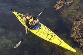 Kayak paddling along